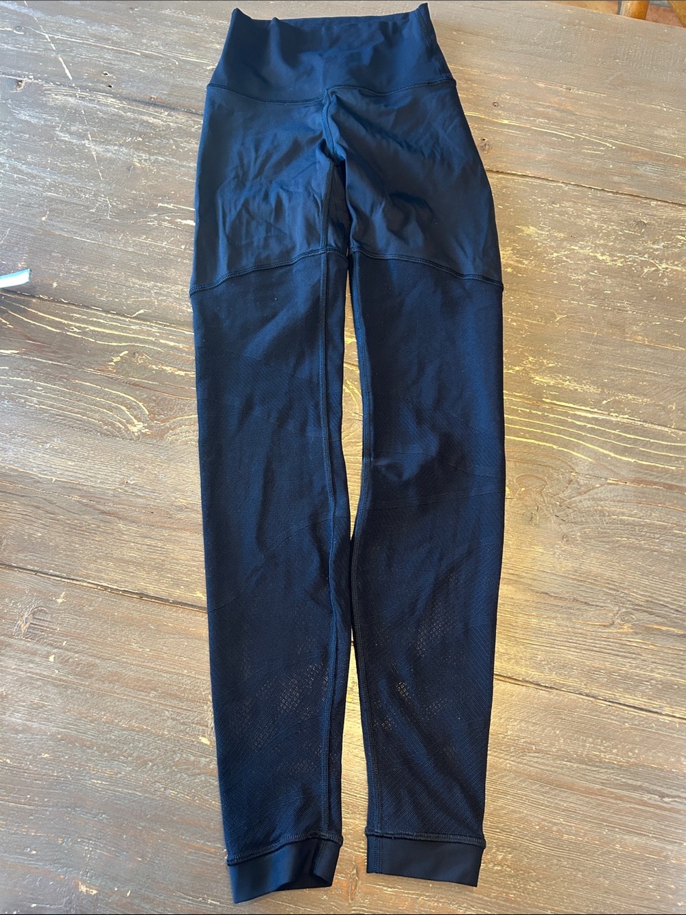 Lululemon Black High-Waist Leggings with Mesh Detail.